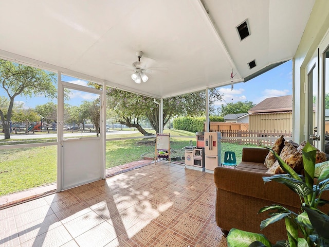 sunroom featuring a ceiling fan