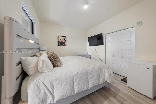bedroom featuring a closet and wood finished floors