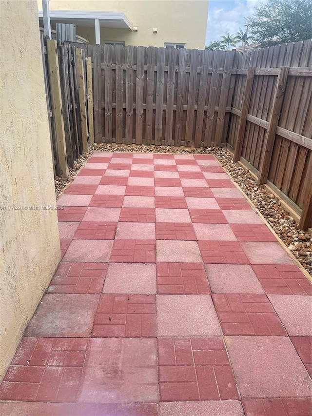 view of patio featuring fence