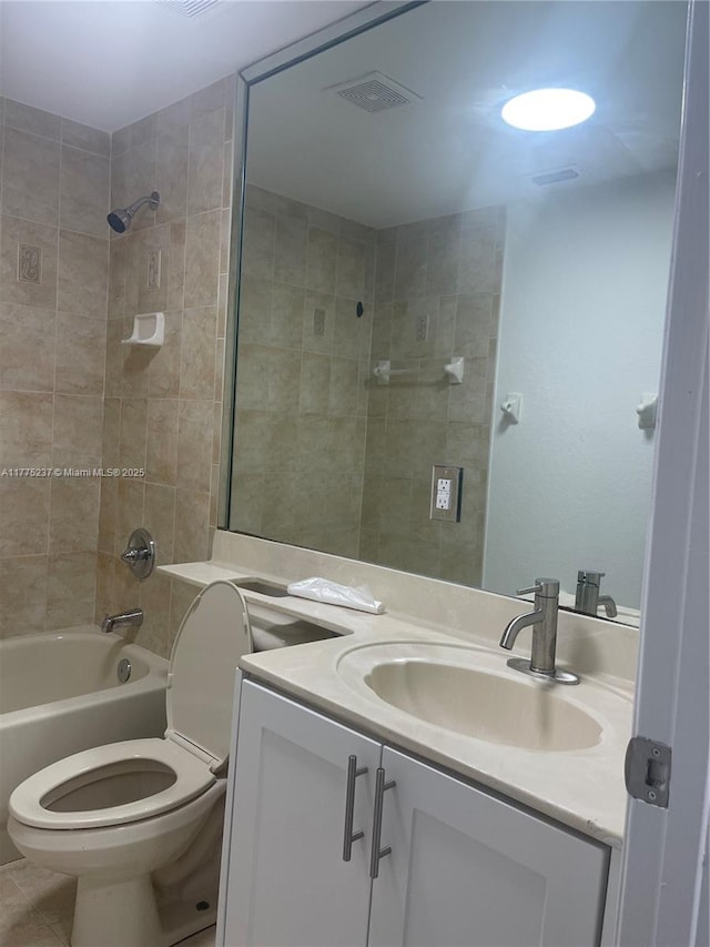 full bath with visible vents, toilet, bathing tub / shower combination, vanity, and tile patterned flooring