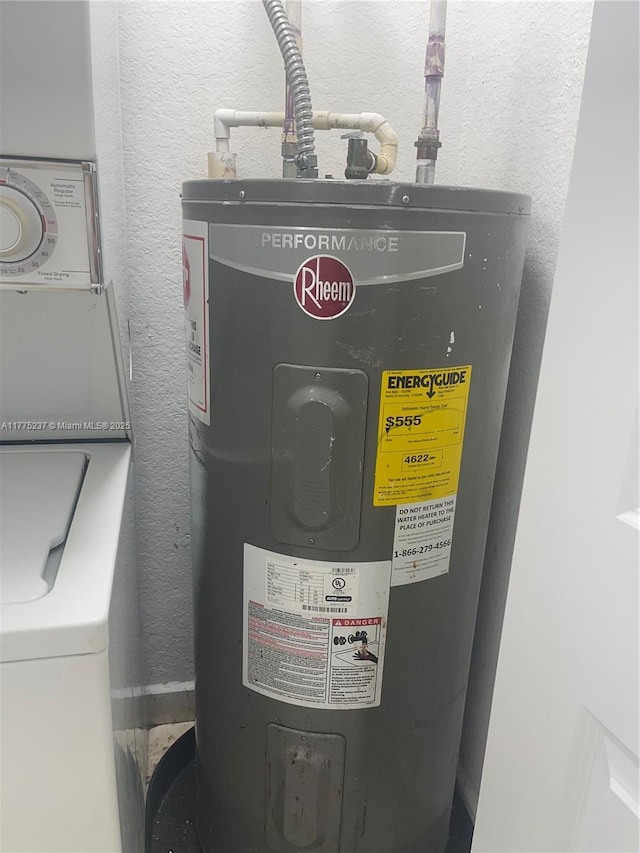 utility room featuring washer / dryer and electric water heater