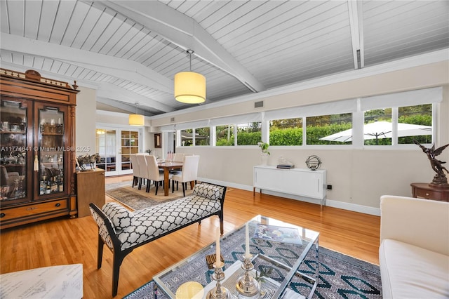 living room with visible vents, baseboards, wood finished floors, vaulted ceiling with beams, and wood ceiling