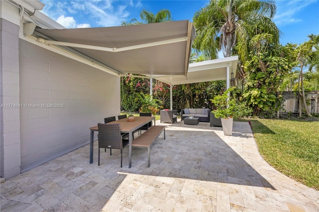 view of patio / terrace with outdoor lounge area, outdoor dining area, and fence