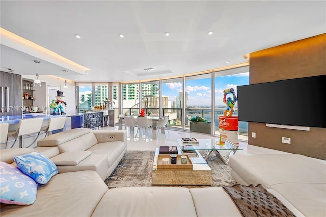 living area with expansive windows and recessed lighting