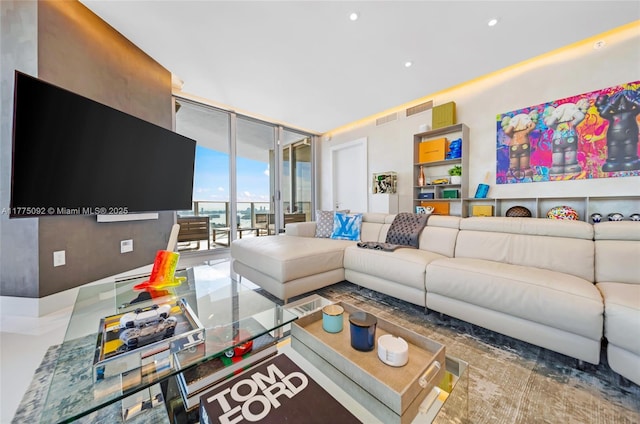 living room with expansive windows and recessed lighting