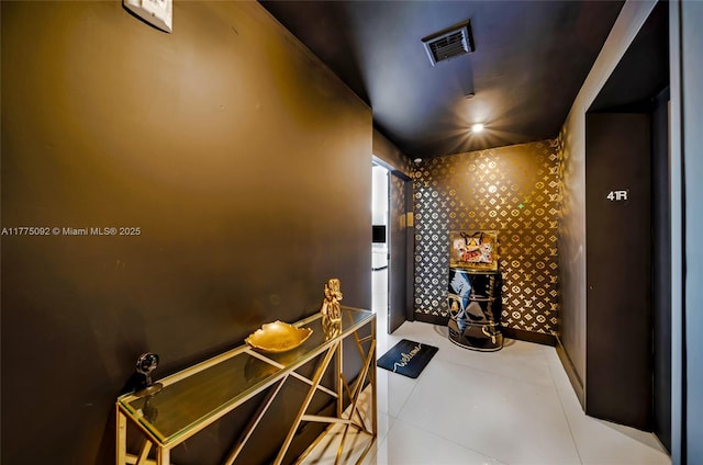 wine cellar featuring baseboards and tile patterned flooring