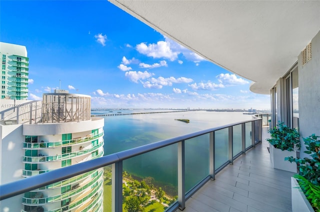 balcony featuring a water view
