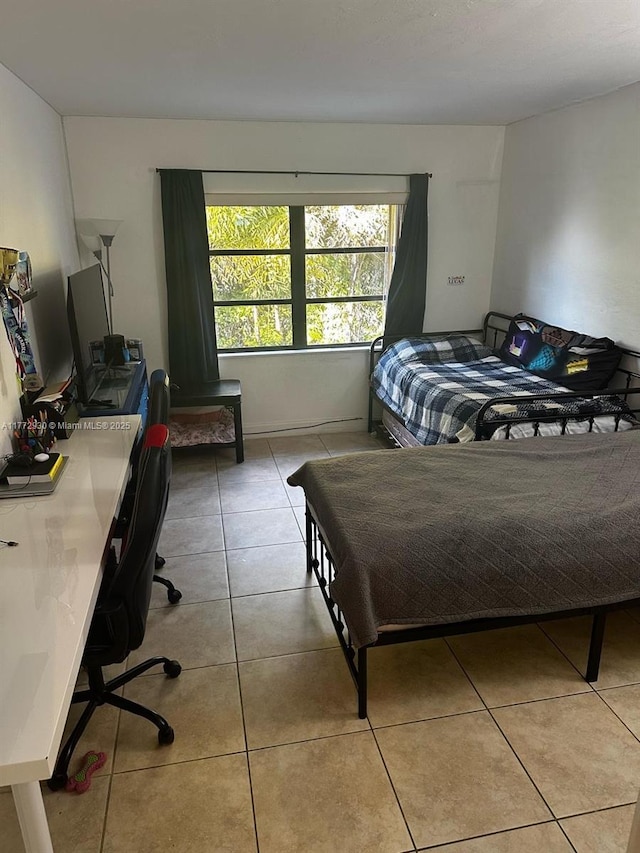 7951 SW 104th Unit 210D, Miami, FL 33156 - bedroom with a desk and tile patterned flooring