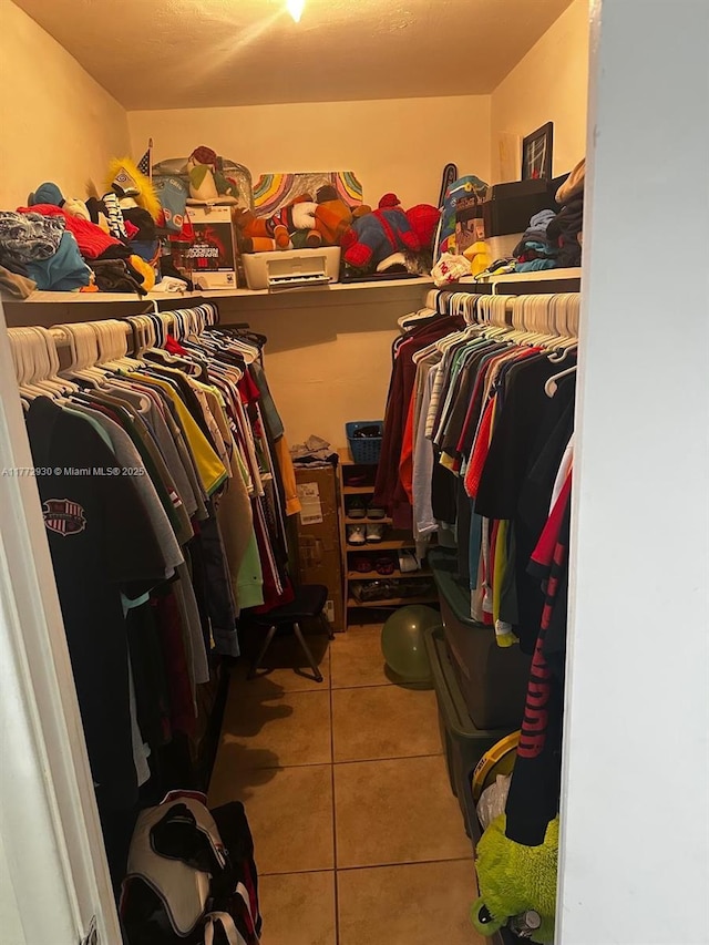 7951 SW 104th Unit 210D, Miami, FL 33156 - walk in closet with tile patterned flooring