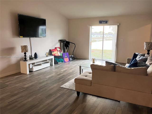 living room with baseboards and wood finished floors