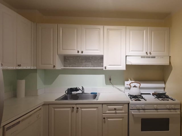 kitchen featuring under cabinet range hood, white appliances, a sink, white cabinets, and light countertops