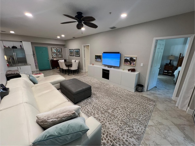 75 Gulfstream Rd Unit 211B, Dania Beach, FL 33004 - living area featuring a ceiling fan, recessed lighting, light marble finish flooring, and baseboards