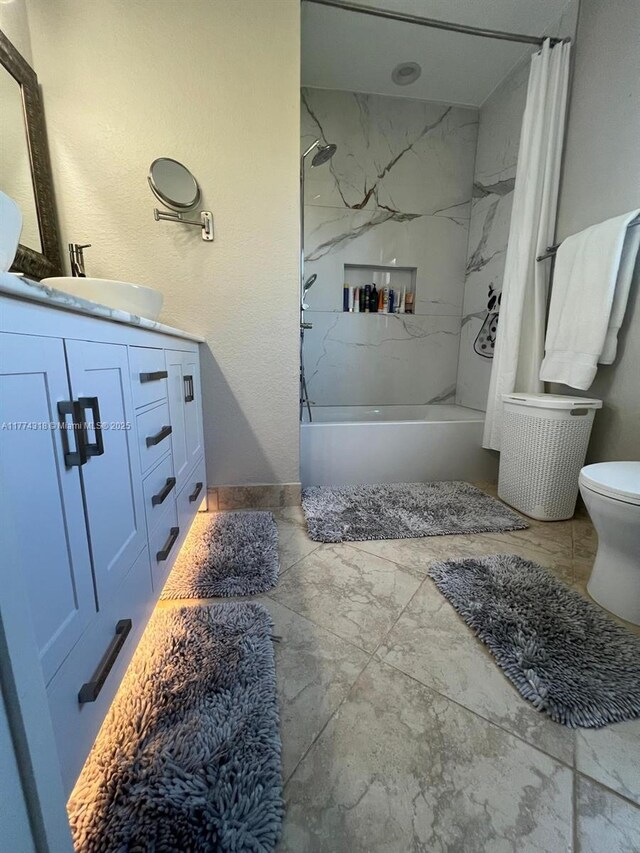75 Gulfstream Rd Unit 211B, Dania Beach, FL 33004 - full bathroom featuring toilet, shower / bathtub combination with curtain, and vanity