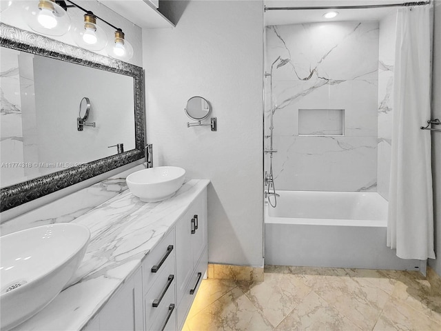 full bathroom featuring shower / bath combination with curtain, double vanity, marble finish floor, and a sink