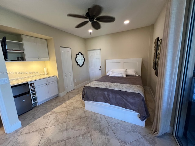 75 Gulfstream Rd Unit 211B, Dania Beach, FL 33004 - bedroom featuring light marble finish floors, baseboards, and ceiling fan