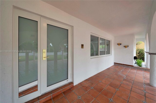 doorway to property with stucco siding