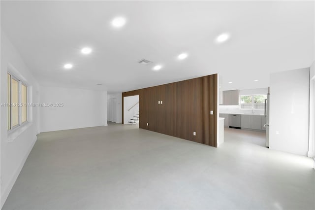 10250 SW 28th St, Miami, FL 33165 - spare room with recessed lighting, concrete flooring, and stairway