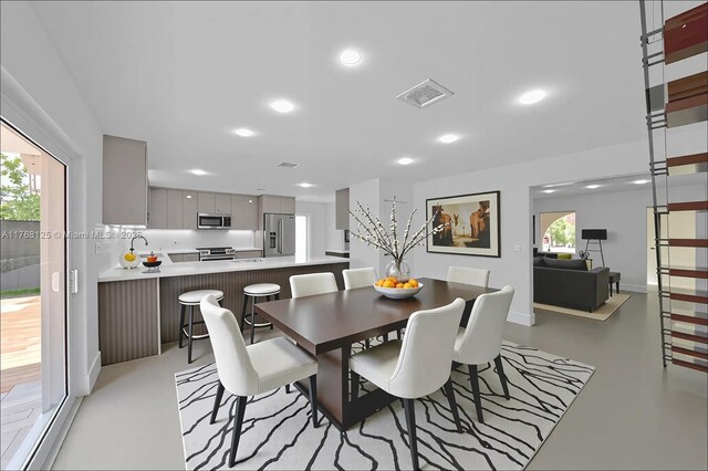 10250 SW 28th St, Miami, FL 33165 - dining room with concrete flooring and recessed lighting