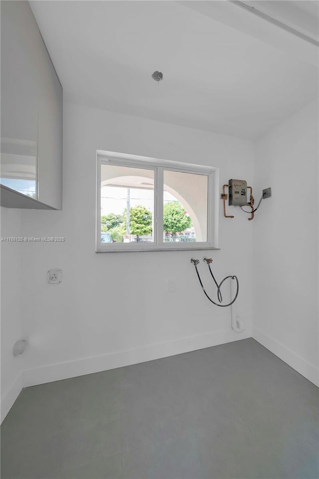 10250 SW 28th St, Miami, FL 33165 - spare room with baseboards and concrete floors
