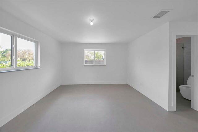 10250 SW 28th St, Miami, FL 33165 - spare room with finished concrete floors and baseboards