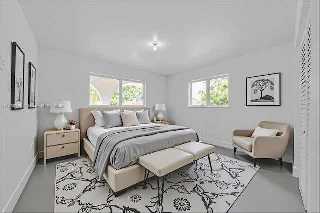 10250 SW 28th St, Miami, FL 33165 - bedroom with baseboards and concrete flooring