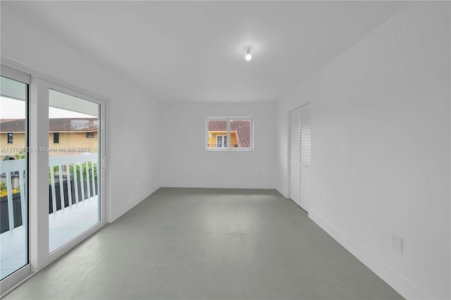 spare room featuring baseboards