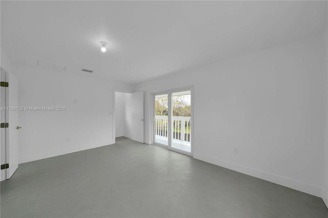 unfurnished room with concrete floors and visible vents