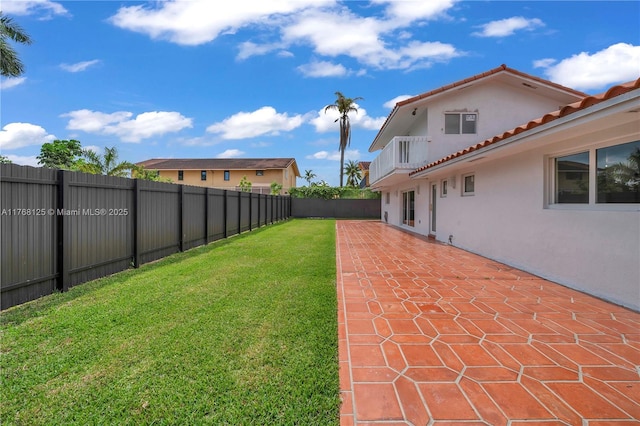 view of yard with a patio area and a fenced backyard