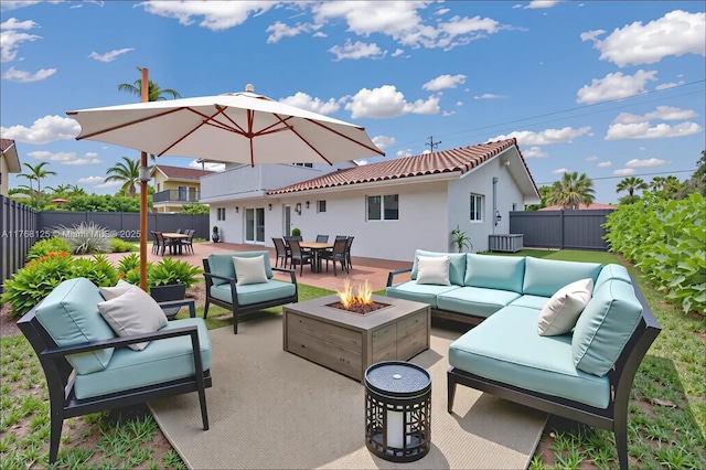 10250 SW 28th St, Miami, FL 33165 - fenced backyard featuring an outdoor living space with a fire pit, outdoor dining space, and a patio