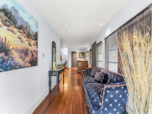 hall with hardwood / wood-style floors