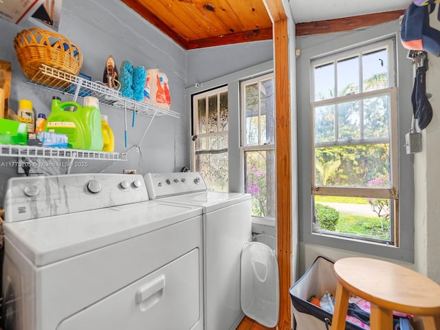 clothes washing area featuring laundry area and washer and dryer