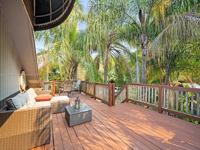 wooden terrace with outdoor lounge area