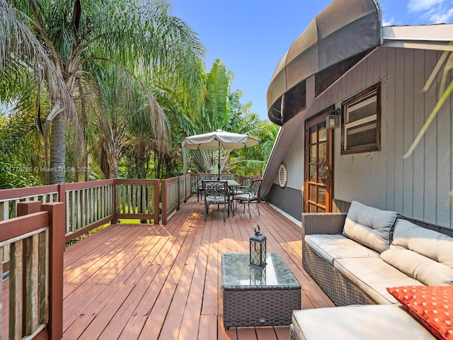 wooden deck featuring an outdoor living space and outdoor dining space