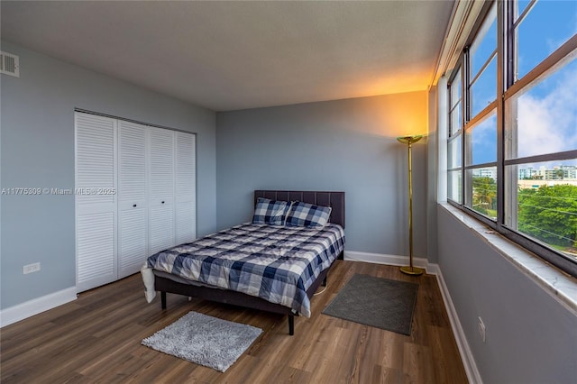 9180 W Bay Harbor Dr Unit 5C, Bay Harbor Islands, FL 33154 - bedroom featuring baseboards, wood finished floors, and a closet