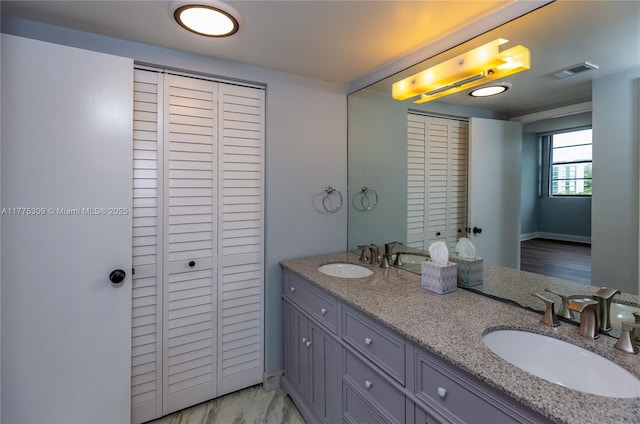 9180 W Bay Harbor Dr Unit 5C, Bay Harbor Islands, FL 33154 - bathroom with a closet and double vanity