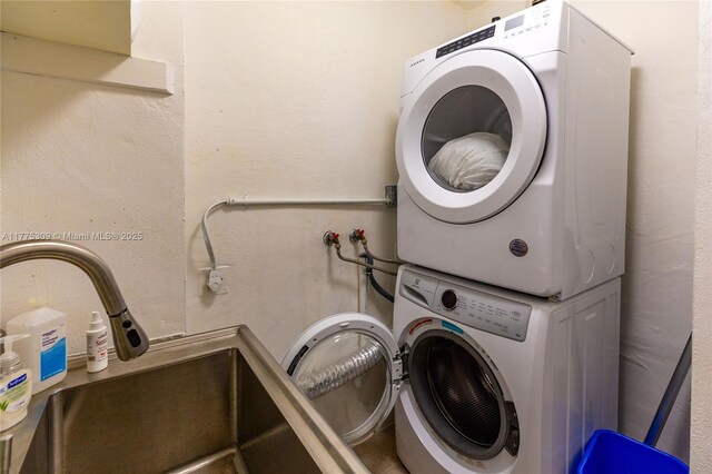 9180 W Bay Harbor Dr Unit 5C, Bay Harbor Islands, FL 33154 - laundry area featuring stacked washer / drying machine
