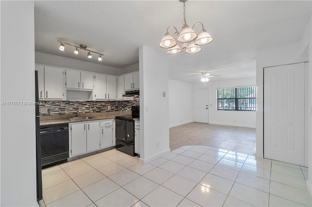kitchen featuring tasteful backsplash, open floor plan, light tile patterned floors, ceiling fan with notable chandelier, and black appliances