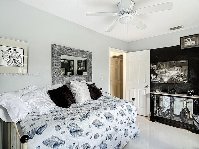 bedroom featuring a ceiling fan, visible vents, and marble finish floor