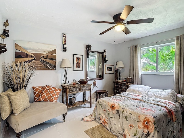 bedroom featuring ceiling fan and tile patterned floors