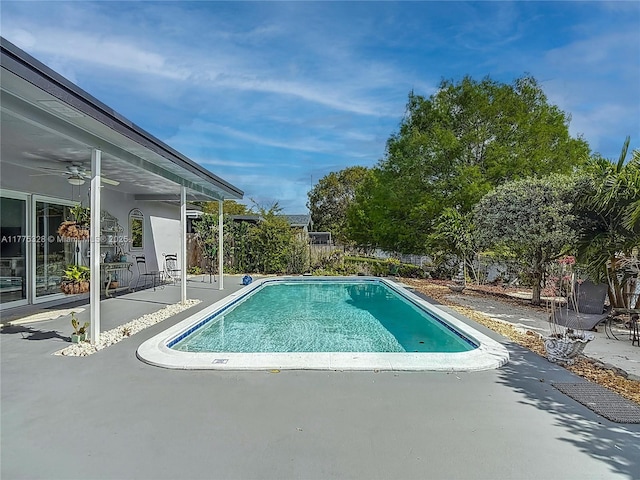view of pool featuring a fenced in pool, ceiling fan, a patio area, and a fenced backyard