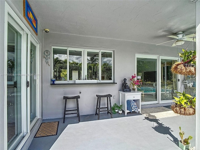 view of patio with ceiling fan