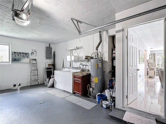 interior space featuring washer and clothes dryer, a garage door opener, water heater, and electric panel