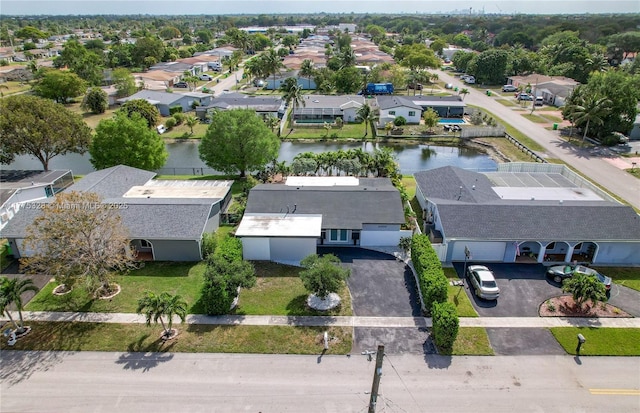 bird's eye view with a residential view and a water view