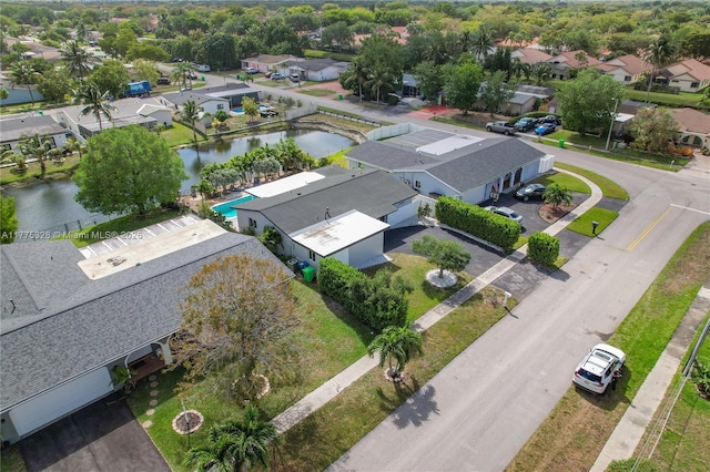 bird's eye view with a residential view and a water view