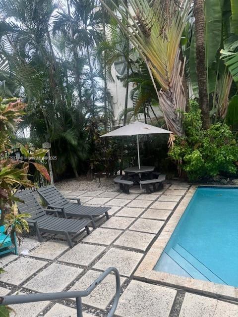 outdoor pool featuring a patio