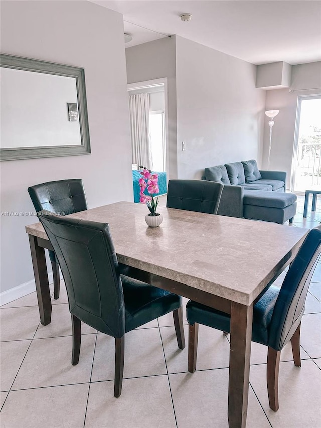 2280 SW 32nd Ave Unit 510, Miami, FL 33145 - dining area with baseboards and light tile patterned floors