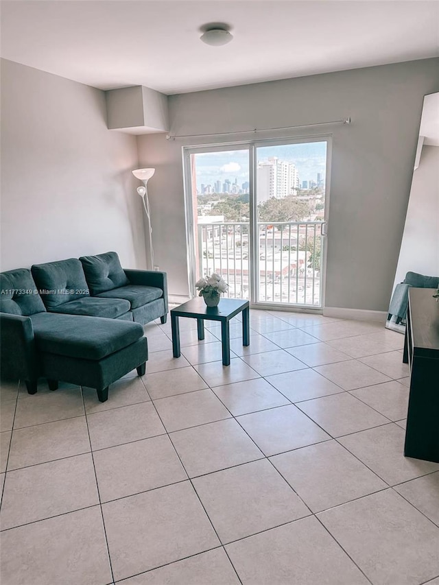 2280 SW 32nd Ave Unit 510, Miami, FL 33145 - living room featuring baseboards, a view of city, and light tile patterned floors
