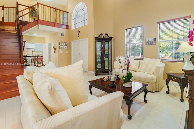 1411 SW 149th Pl, Miami, FL 33194 - living area featuring stairway, light tile patterned floors, and a towering ceiling