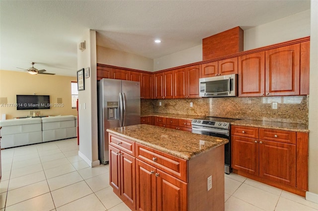 1411 SW 149th Pl, Miami, FL 33194 - kitchen with appliances with stainless steel finishes, light stone countertops, backsplash, a center island, and recessed lighting