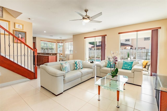1411 SW 149th Pl, Miami, FL 33194 - living room featuring ceiling fan, healthy amount of natural light, and stairway